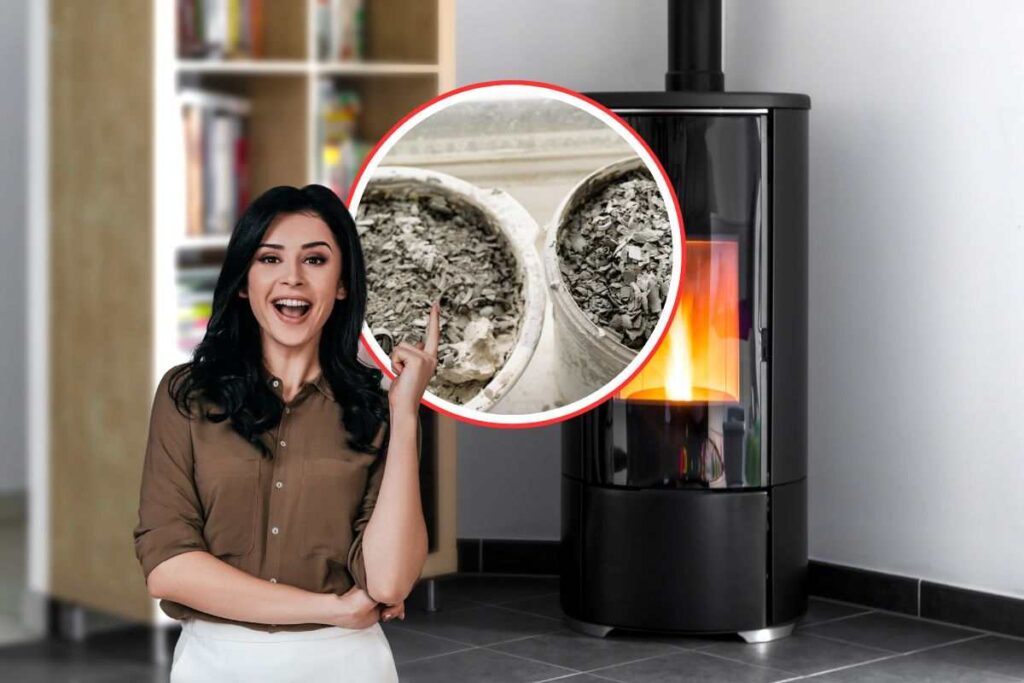 stufa a pellet come sfondo, donna con idea che indica della cenere
